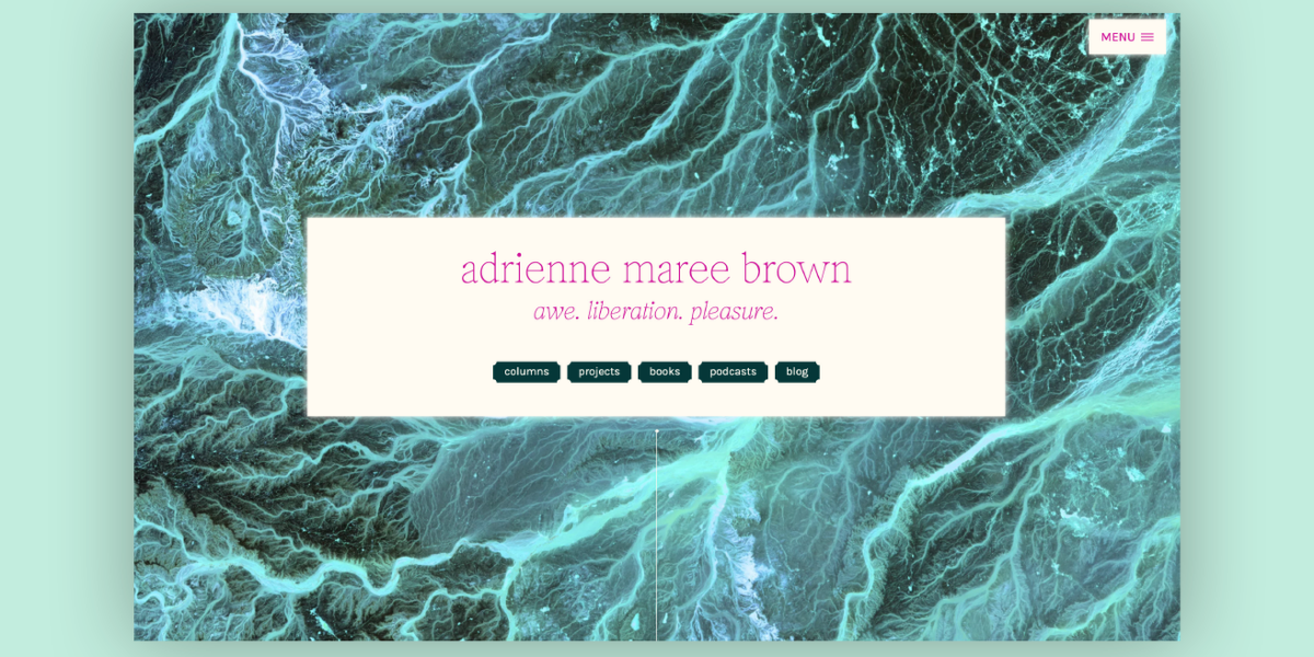The website landing page for adrienne maree brown features a full-screen background image with a rich, textured look resembling flowing water or marbled patterns in shades of teal and dark blue. Centrally overlaid is a white text box containing the name "adrienne maree brown" in lowercase, elegant typography, followed by the words "awe. liberation. pleasure." in a smaller font. Below this, a navigation bar with buttons such as 'columns', 'projects', 'books', 'podcasts', and 'blog' invites further exploration.